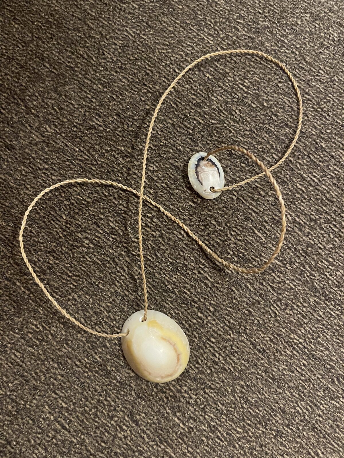 Shell pendant on hand-braided natural cord in the Hawaiian cordage tradition