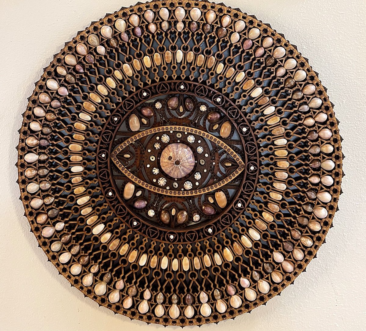 Eye Mandala — handmade Hawaiian shell mosaic wall art by Aaron Pomerantz, cowrie shells on panel