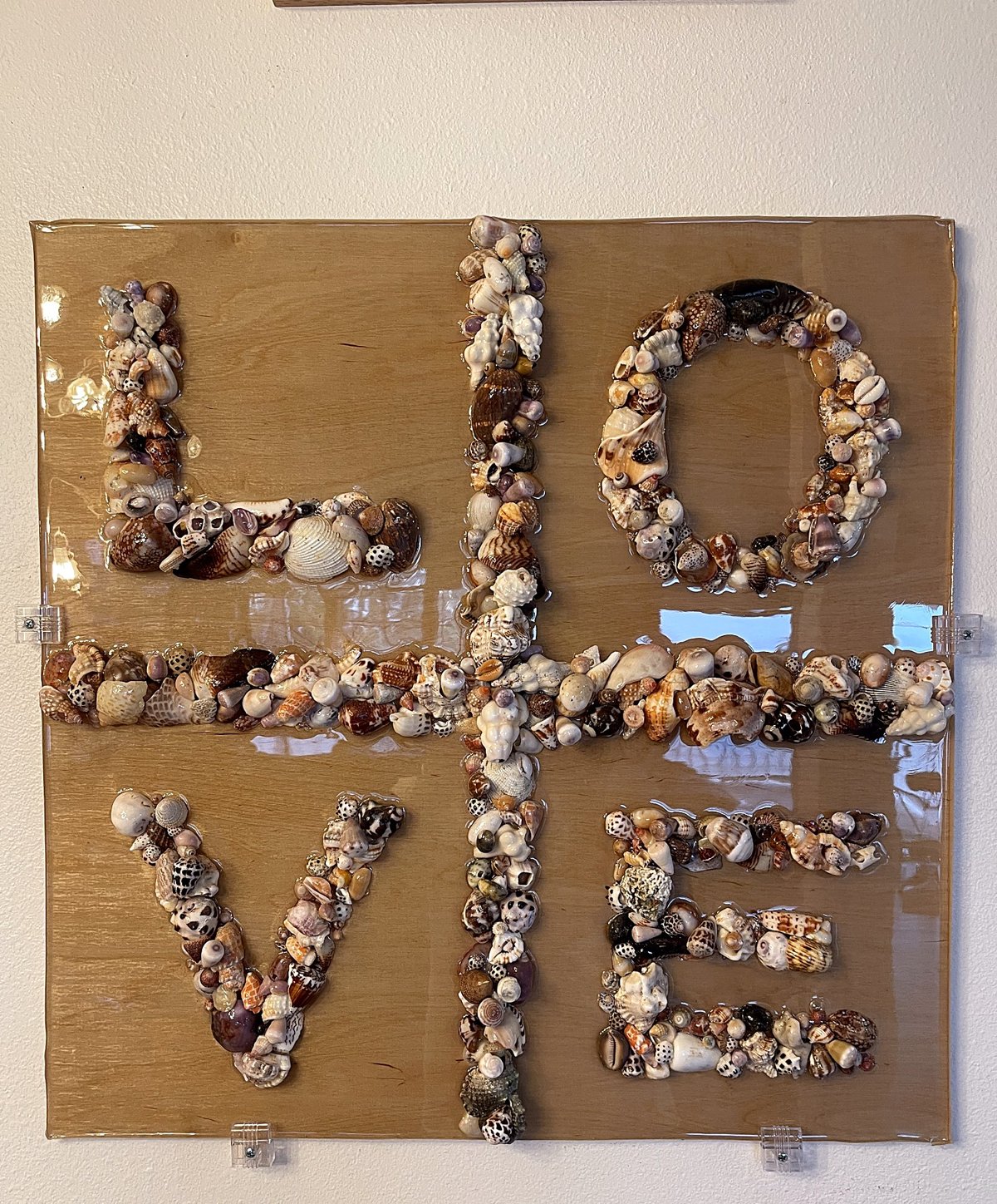 LOVE — handmade Hawaiian shell mosaic wall art by Aaron Pomerantz, cowrie shells on panel